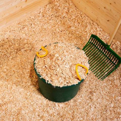 New Shavings in a Stall with a Muck Tub and Fork