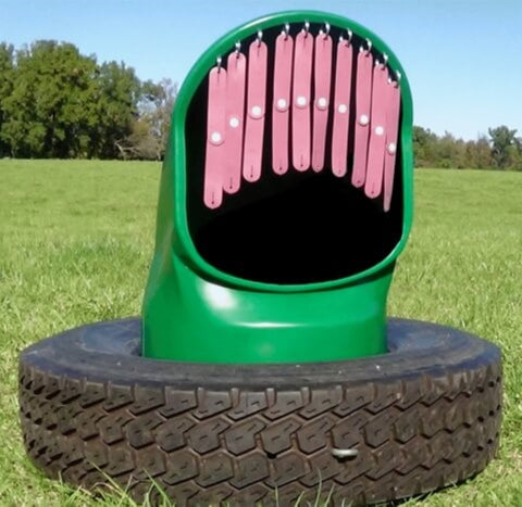A cow mineral feeder with fly strips