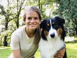 Cassie Nilsson Employee Headshot with Marty the dog