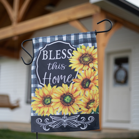 Bless this Home Garden Flag in front of a home