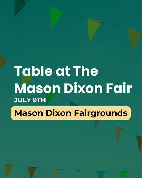 Advertisement for a table at The Mason Dixon Fair with event details on a green background.