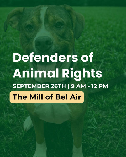 Promotional graphic for an animal rights event featuring a dog on a grassy background with a green overlay. White text reads 'Defenders of Animal Rights' with additional event details 'SEPTEMBER 26TH | 9 AM - 12 PM' and a yellow badge reading 'The Mill of Bel Air'.