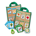 Melissa & Doug Let's Explore In/Out Scavenger Hunt toy set with colorful cards and game pieces for kids' outdoor and indoor exploration.