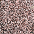 Autumn Red Stone from KolorScape, natural stone and sand mix with rich red and earthy tones, ideal for landscaping or decorative projects.