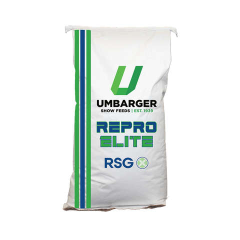 A bag of Umbarger Repro Elite Show Feed for Goats with a green and blue stripe. 