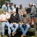 Agronomy team on the back of a truck tailgate