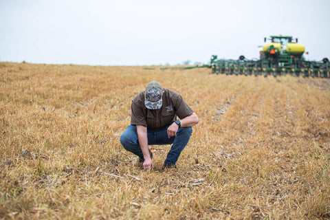 Employee checking seed depth