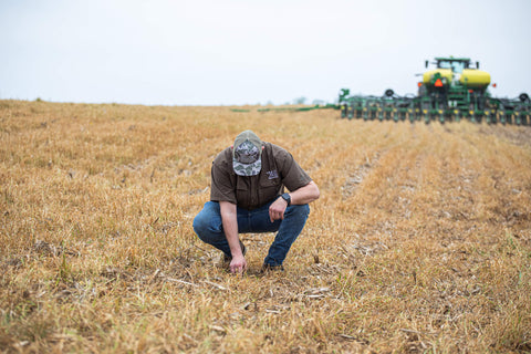 Employee checking seed depth