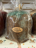 Americana vintage candle featuring a cozy cabin in the woods design, perfect for rustic home decor and ambiance.