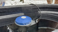 Farm Innovators 1250 Watt floating plastic tank de-icer for keeping livestock water tanks ice-free in winter.