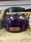 A Cheerful Giver Aurora Sky Candle with a serene sky-inspired design and soft glowing light in a glass jar.