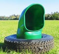 AmeriAg Green mineral livestock feeder inside a tire, 22.5 inches, designed for ground feeding of livestock.