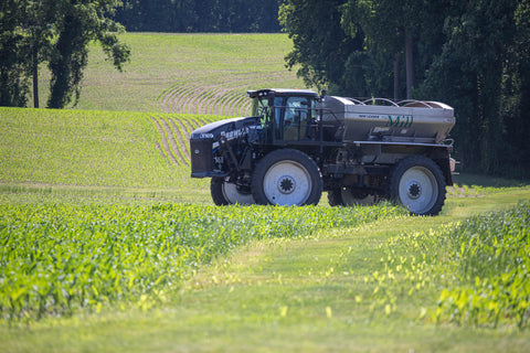 Spreading fertilizer on corn