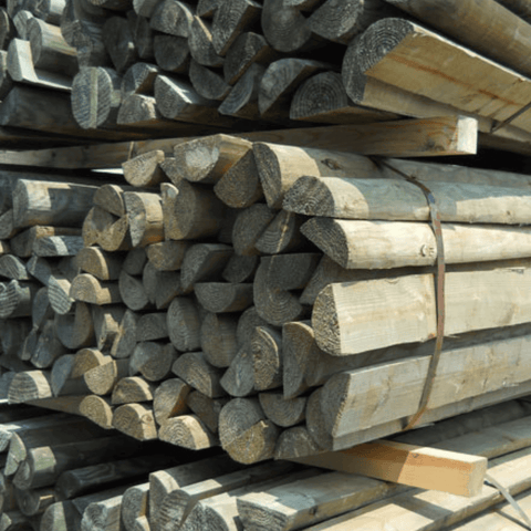 8 ft pressure-treated Half Round Fence Post by Statesman with 6-7 inch diameter, suitable for fencing projects.