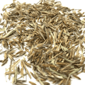 Close-up of Chesapeake Valley Seed Indiangrass Turf Seed showing small grass seed grains on a neutral background.