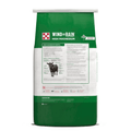 A bag of Wind & Rain High Magnesium animal supplement, featuring a green and white packaging design with a cow illustration and product details.