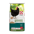 A bag of Purina Organic 16 Layer Crumbles chicken feed for laying hens, featuring a black hen and egg on a white, green, and teal background.