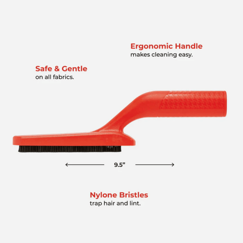 Red brush with ergonomic handle and nylon bristles on a white background