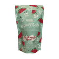 Package of Uckels Equine Equi Treats with watermelon and basil flavor on a light green background