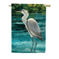 Decorative flag with a heron standing in water and trees in the background