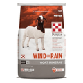 A 25 lb bag of Purina Wind and Rain Goat Mineral dog food, featuring a brown and white goat on a white and orange background with a gray base.