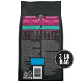 Back view of a 3 lb bag of pet food, showing the product information panel in pink, teal, and white on a black background, with a circular '3 LB BAG' badge on the right.