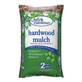 Jolly Gardener hardwood shredded mulch spread evenly, showing its natural brown color and textured shredded wood appearance.