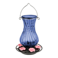 Blue glass hummingbird feeder with pink flowers on a white background