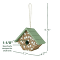 A small house-shaped birdhouse with a green roof, white floral pattern on the front, and a hanging loop, shown with dimension lines and text indicating measurements of 9.75 inches tall, 7.
