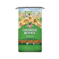 A bag of Kalm巴赫 Reserve Extraordinary Chick Feed, featuring a green and white package design with illustrations of yellow chicks in a flower field.