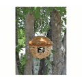Round Hanging Grass Roosting bird house hanging in a tree