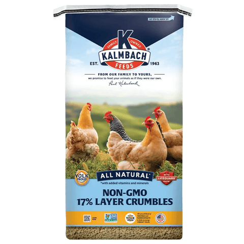 A bag of Kalmbach Feeds Non-GMO 17% Layer Crumbles on a plain white background. The packaging features a blue and white design with a photo of several chickens in a field.