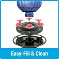 Blue glass globe with pink nozzles and black base on a white background