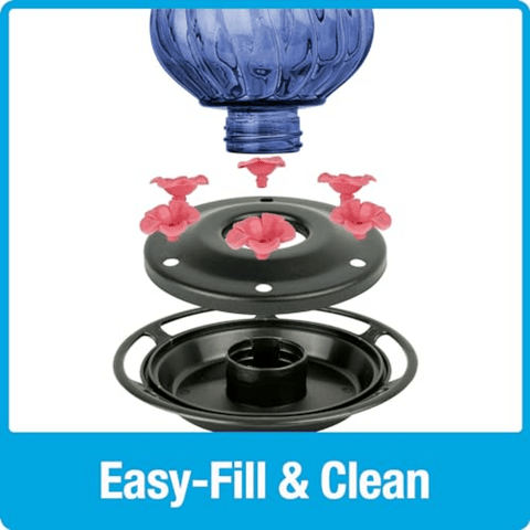 Blue glass globe with pink nozzles and black base on a white background