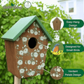 Wooden birdhouse with a green roof and white floral print on the front, shown outdoors with feature callouts and a small bird illustration. The image includes the Wild Wings logo and text reading Easy-Hang Design, Designed for Small Birds, and Verdant Petals Design.