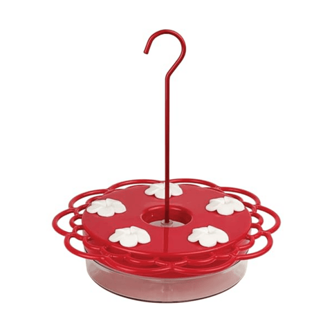 Red bird feeder with floral designs and a hanging hook on a white background