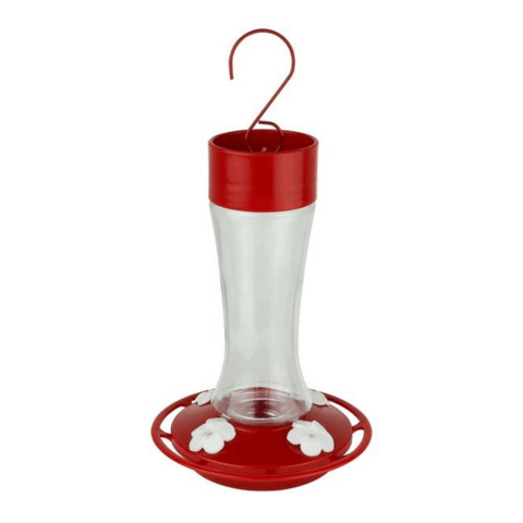 Red and clear hummingbird feeder on a white background