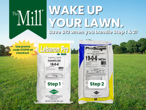 Two bags of lawn fertilizer with 'The Mill' branding and a grassy field in the background.
