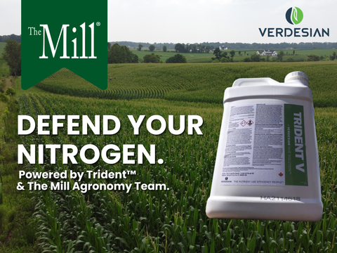 Fertilizer container with 'The Mill' and 'Verdesian' branding in a field setting.
