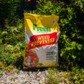 Bag of Preen Garden Weed Preventer in a garden setting