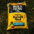 Bag of Black Kow Organic Raised Bed Planting Mix on grass