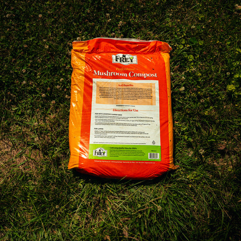 Orange bag of Fidley Mushroom Compost on grass