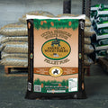 American Wood Fiber AWF Ultra Premium White Pine Wood Heat Pellets in a bag, showing cylindrical pellet shape and white pine wood material.