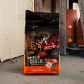 A bag of apple crushed deer attractant with pots in the background
