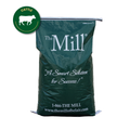 Green bag with 'The Mill' branding and text on a white background
