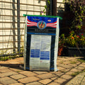 A large bag of Nutrena Respond Original Beef-Pulp Feed stands on a stone patio in front of a fence and garden plants.
