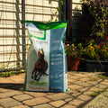 Nutrena Triumph Active 12 Pellet Horse Feed bag showing a close-up of the branded horse feed pellets in a bag.