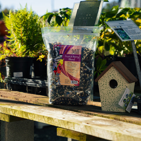 Bird food blend by The Mill featuring mixed fruits and berries for attracting and nourishing wild birds.