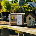 Purina Premium Wild Bird Block showing a close-up of the bird feed block with natural textures and packaging details.