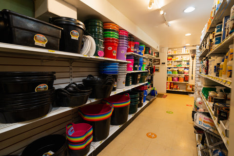 Storage room with shelves stocked with various containers and supplies
